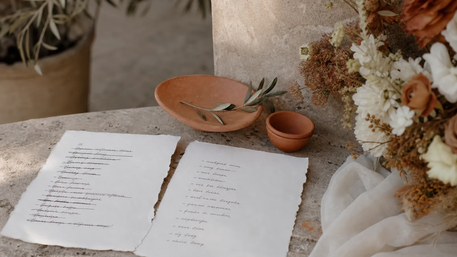 A crossed-out planning note next to a corrected wedding to-do list