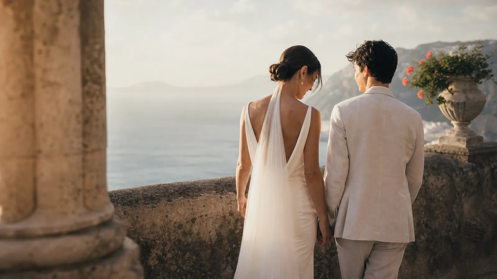 A coastal destination wedding venue with a view over the sea at golden hour