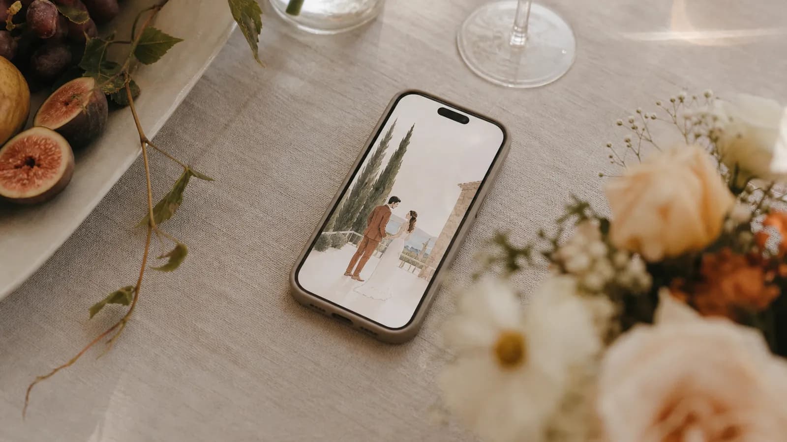 A phone resting on a linen tablecloth showing an animated digital wedding invitation